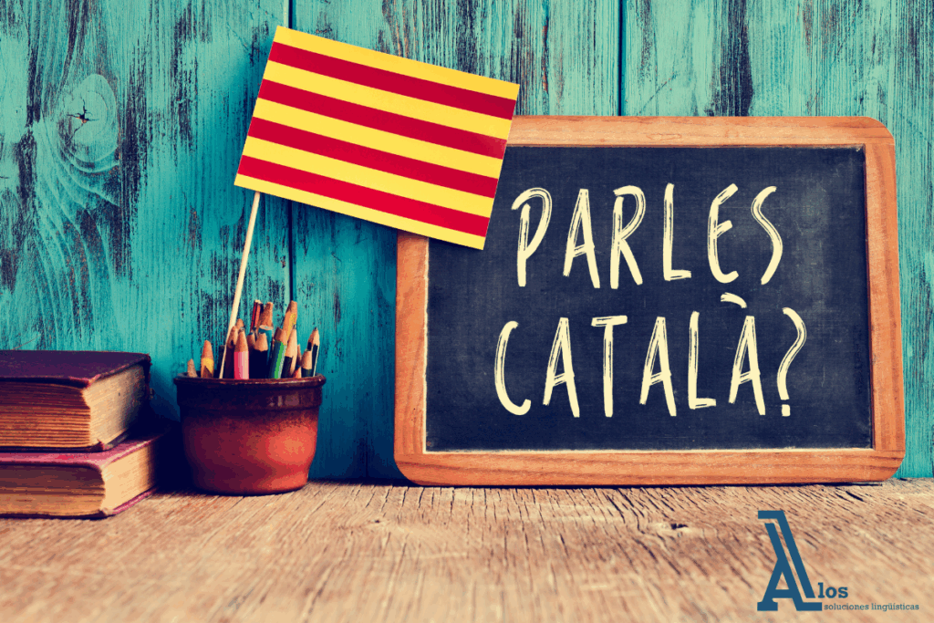 Promoción del uso del catalán en el ámbito educativo y social Bandera catalana junto a una pizarra con la frase "Parles català?", invitando al uso del idioma en un contexto educativo.