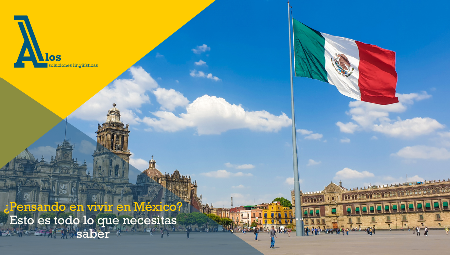 Bandera de México ondeando frente a un monumento emblemático en Ciudad de México